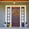 20-inch fall wreath adorned with brown magnolia leaves and small pomegranate berries, suitable for home, outdoor, farmhouse, porch, wall, and window d